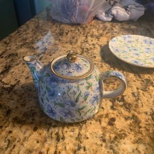 Small teapot with saucer.